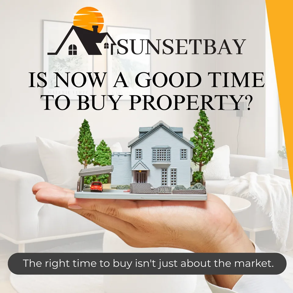 Is now a good time to buy property? A hand holding a miniature model house